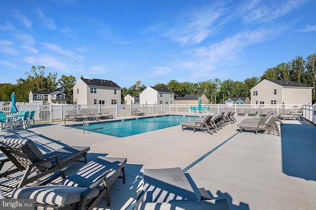 view of swimming pool with a patio