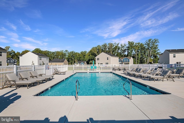 view of swimming pool with a patio