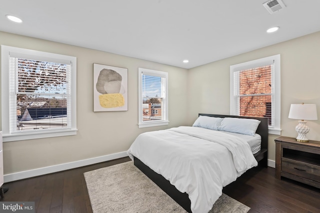 bedroom featuring dark hardwood / wood-style flooring