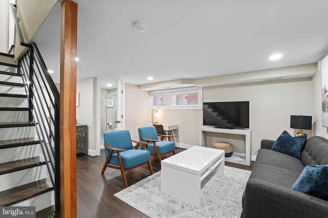 living room featuring dark wood-type flooring