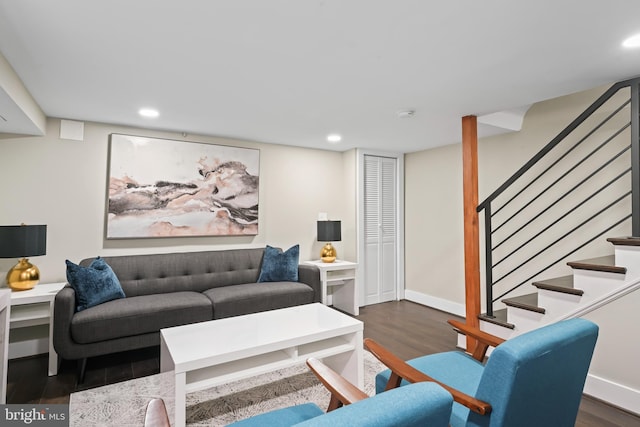 living room with dark hardwood / wood-style flooring