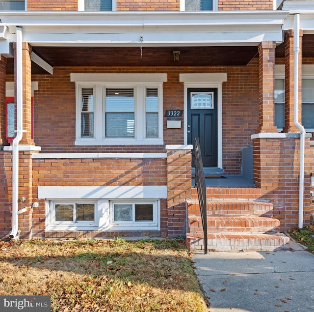 property entrance featuring covered porch