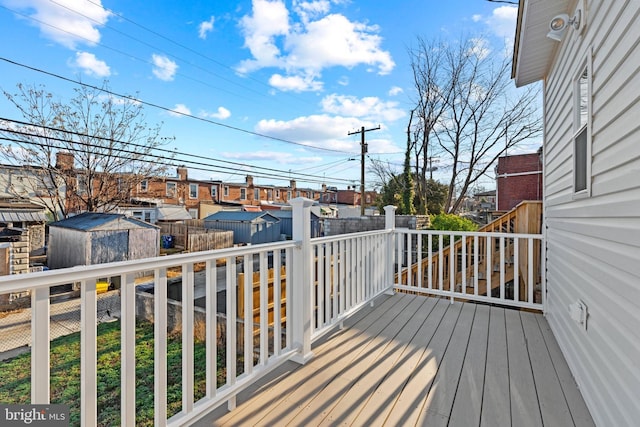 deck featuring a storage shed