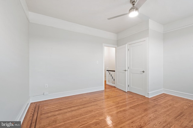 unfurnished room featuring light hardwood / wood-style floors and ceiling fan