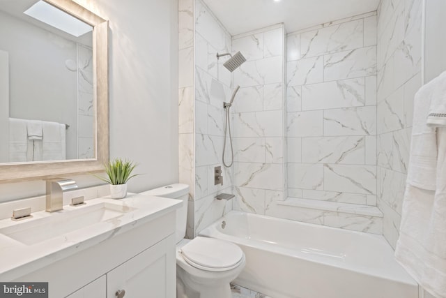 full bathroom with a skylight, toilet, vanity, and tiled shower / bath