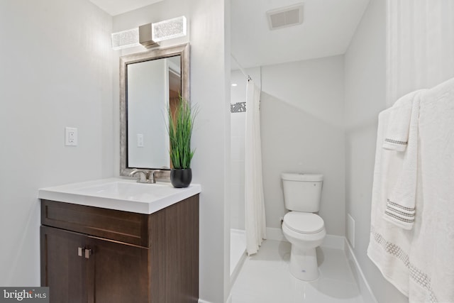 bathroom with tile patterned floors, a shower with curtain, vanity, and toilet