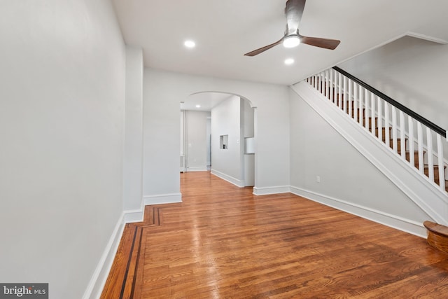 interior space with ceiling fan and hardwood / wood-style flooring