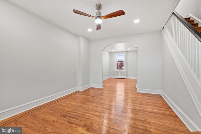 unfurnished room with light hardwood / wood-style flooring and ceiling fan