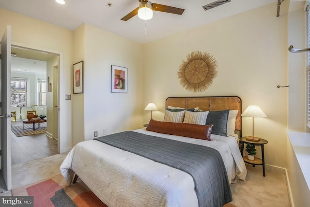 carpeted bedroom with a ceiling fan, recessed lighting, visible vents, and baseboards