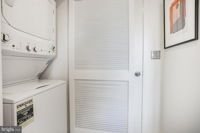 clothes washing area with laundry area and stacked washer / drying machine