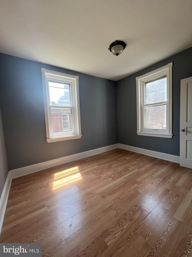 spare room with light wood-type flooring