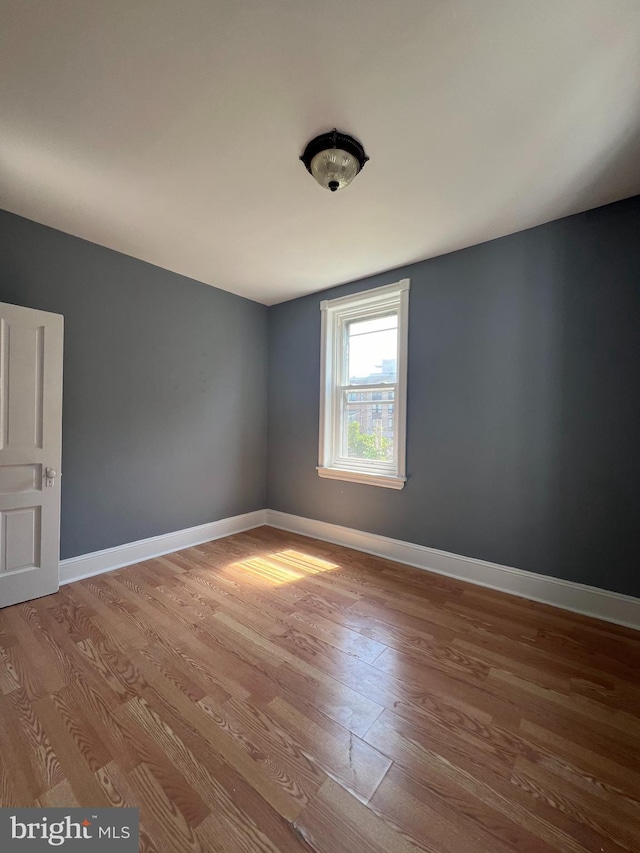 unfurnished room featuring light hardwood / wood-style flooring