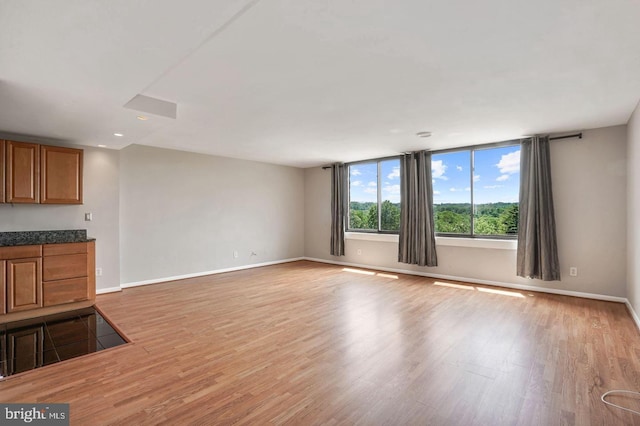 unfurnished living room featuring light wood-type flooring