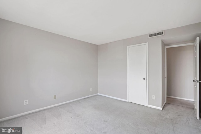 unfurnished bedroom featuring light carpet