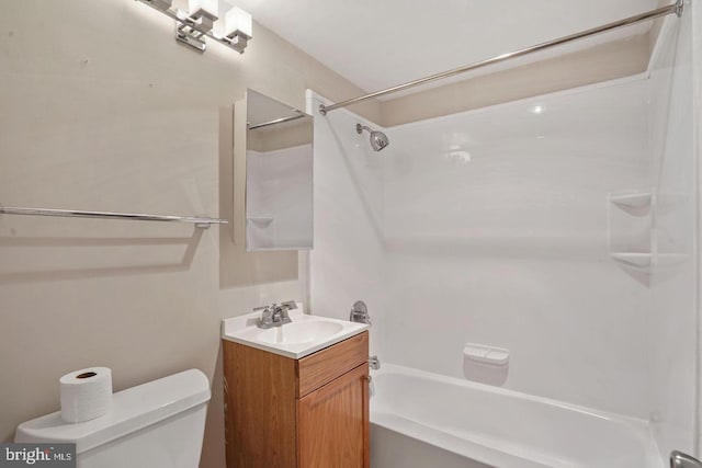 full bathroom featuring washtub / shower combination, vanity, and toilet