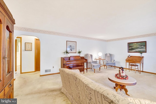 living area with light colored carpet