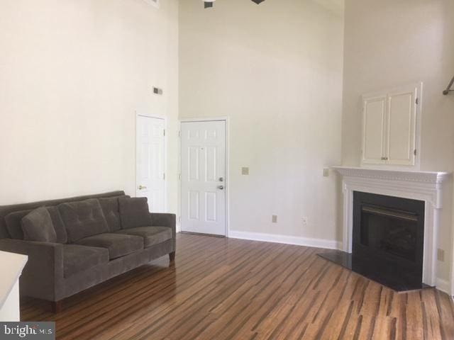 living room with a towering ceiling