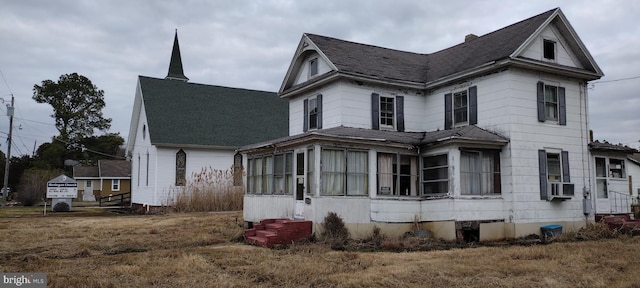 view of home's exterior with cooling unit