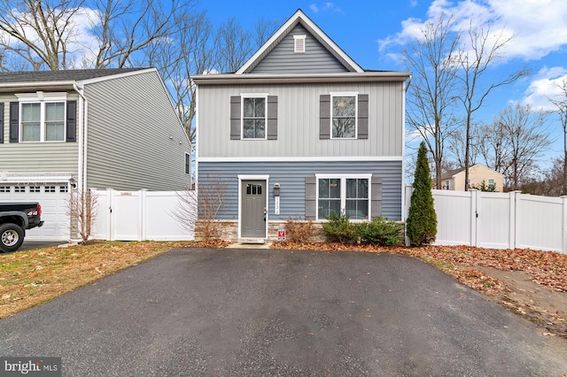 view of front of property with a garage