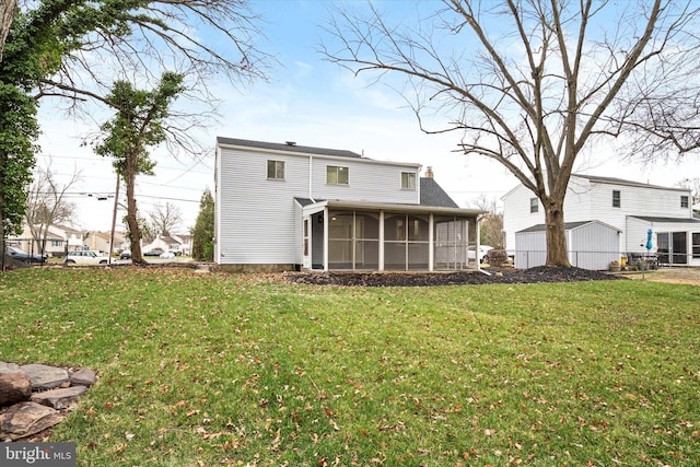 back of house with a lawn and a sunroom