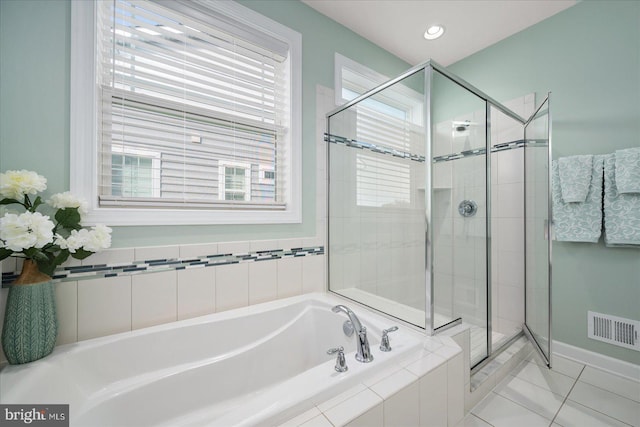 bathroom featuring shower with separate bathtub and tile patterned floors