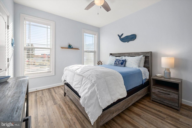 bedroom featuring hardwood / wood-style flooring and ceiling fan