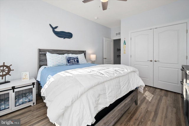 bedroom with ceiling fan, a closet, and dark hardwood / wood-style floors