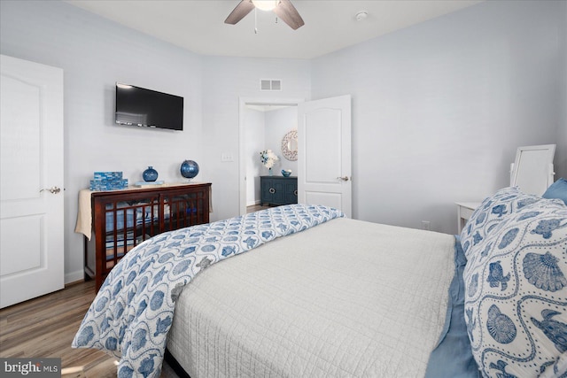 bedroom featuring ceiling fan and dark wood-type flooring