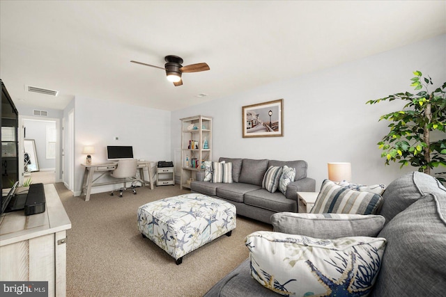 living room featuring ceiling fan and carpet floors