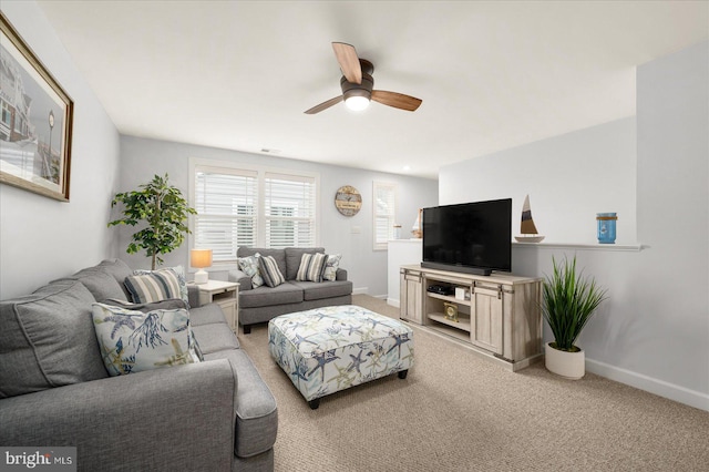 living room featuring ceiling fan and carpet floors