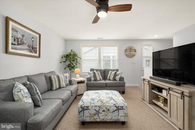 living room featuring light colored carpet and ceiling fan