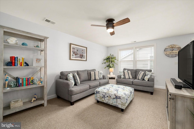 carpeted living room featuring ceiling fan