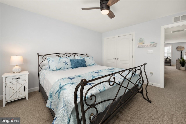 bedroom featuring ceiling fan, light colored carpet, and a closet