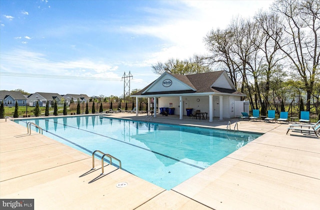 view of swimming pool with a patio