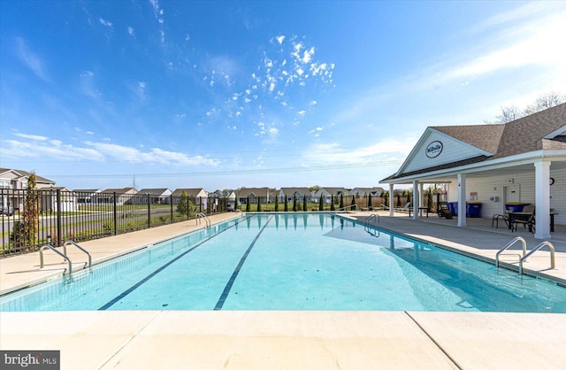 view of swimming pool featuring a patio area