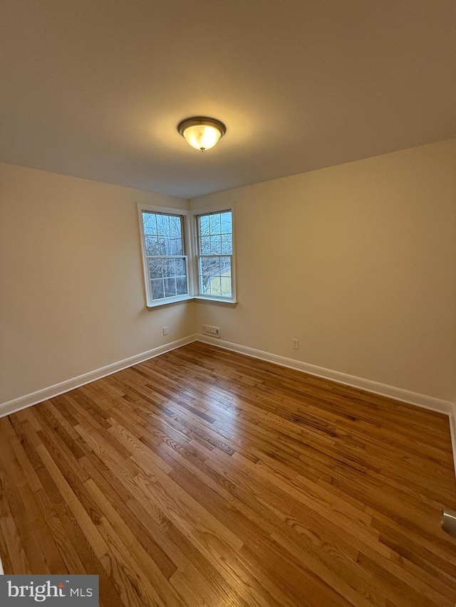 spare room featuring light hardwood / wood-style floors