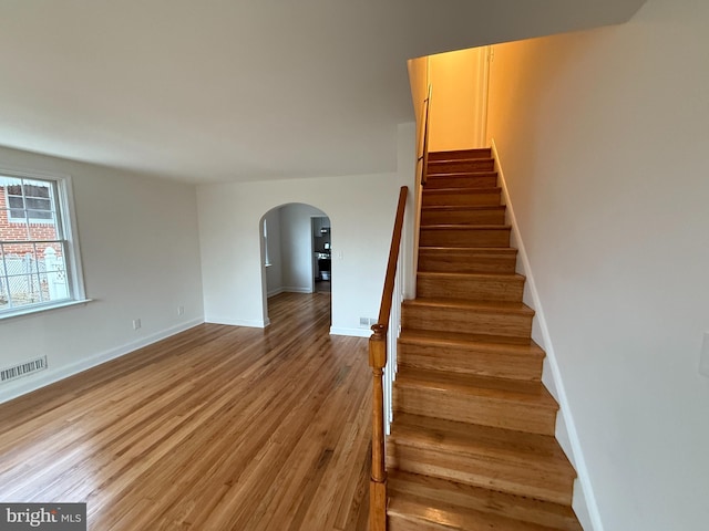 stairway with wood-type flooring