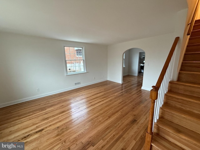 spare room featuring light hardwood / wood-style floors