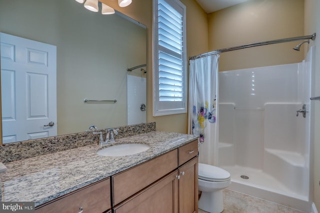 bathroom featuring curtained shower, toilet, tile patterned floors, and vanity