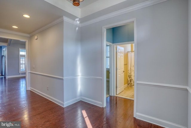 unfurnished room with dark hardwood / wood-style flooring and crown molding