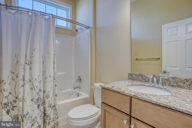 full bathroom with toilet, vanity, and shower / bath combination with curtain