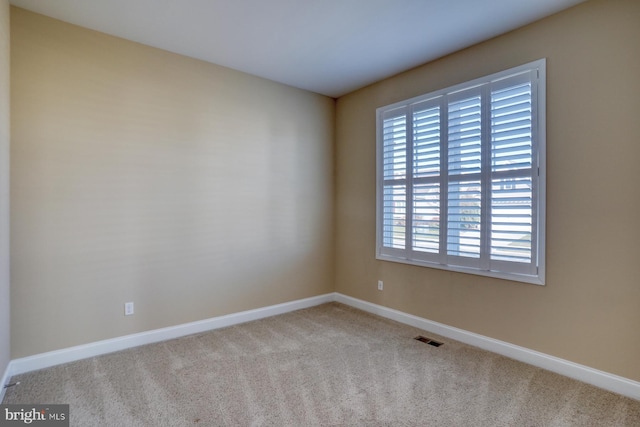 view of carpeted spare room