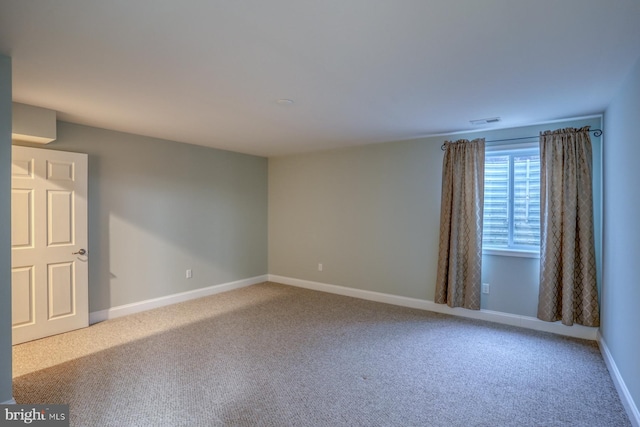 spare room featuring carpet flooring