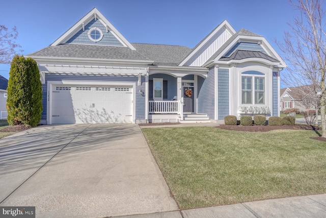 view of front facade featuring a garage, covered porch, and a front yard