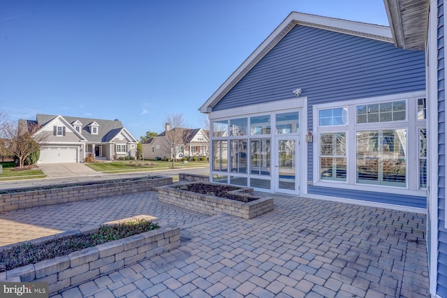 view of patio featuring a garage