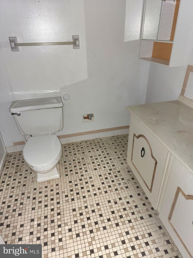 bathroom featuring tile patterned floors and toilet