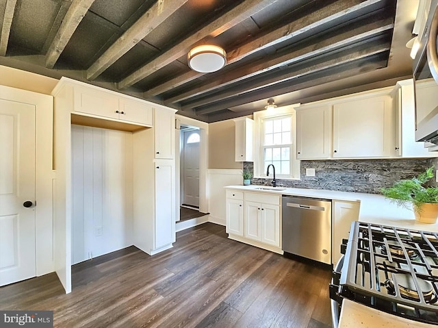 kitchen featuring white cabinets, dishwasher, sink, and dark wood-type flooring