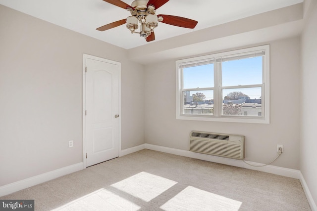 spare room featuring light carpet and a wall mounted AC