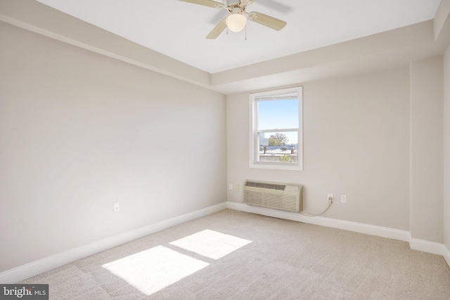 unfurnished room featuring light carpet, a wall mounted air conditioner, and ceiling fan