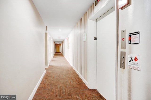 hall featuring parquet flooring and elevator